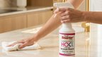 Woman cleaning a kitchen counter with the 16oz Multi-Use HOCl Spray